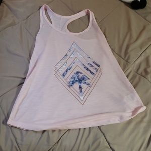A light pink tank top with a design